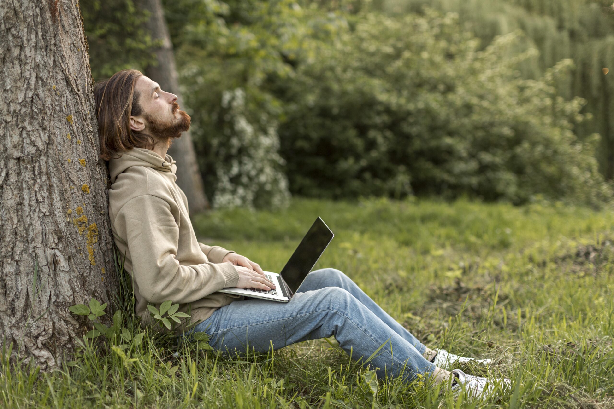 side-view-man-nature-with-laptop