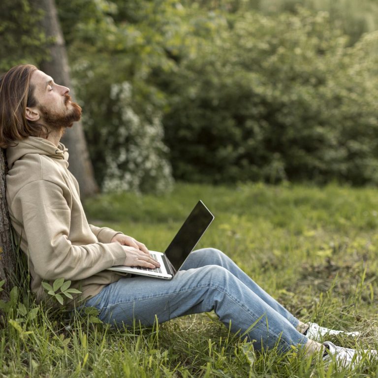 side-view-man-nature-with-laptop